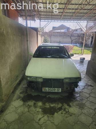 Mazda 323 VI (BJ) Рестайлинг 1.6 MT