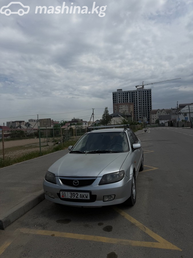 Mazda 323 VI (BJ) Рестайлинг 1.6 MT