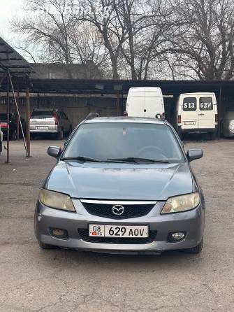 Mazda 323 VI (BJ) Рестайлинг 1.6 MT