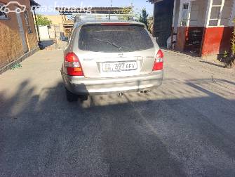 Mazda 323 VI (BJ) Рестайлинг 1.5 MT