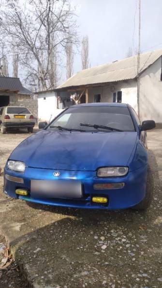 Mazda 323 V (BA) 1.5 MT