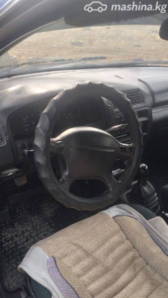 Mazda 323 V (BA) 1.5 MT